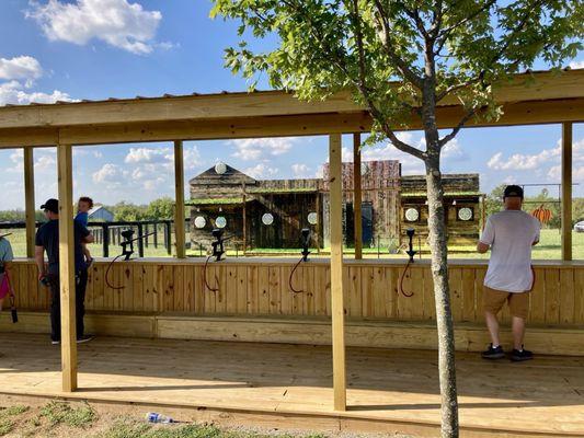 Shoot paintballs at targets