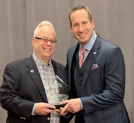 Platinum award with RE/MAX CEO Adam Contos
