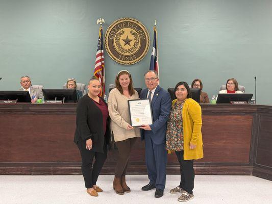 The team accepting the Enrolled Agent proclamation given by the City of Del Rio, TX