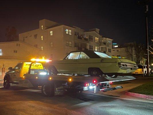 Amazing old school car on the back of North Hollywood Tow Truck