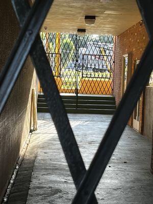 Both entryways to theater gated shut on the evening of their advertised show they sold tickets for.