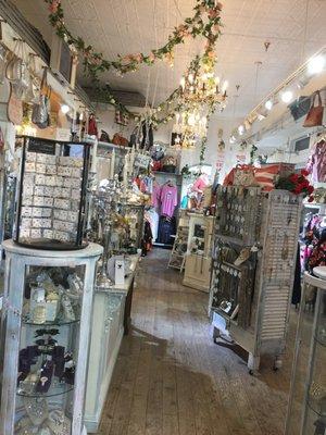 Large boutique with 10 chandeliers and 15 foot high metal ceilings to creat a very elegant place to shop
