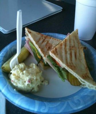 Flat bread ham sandwich with potato salad & pickle