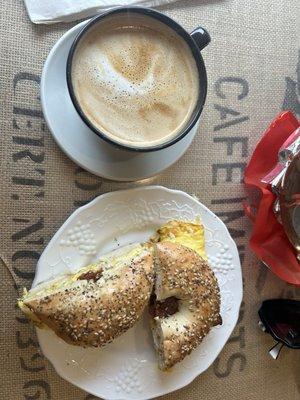 Hot Latte and Bacon, Egg, and Cheese on and Everything Bagel.