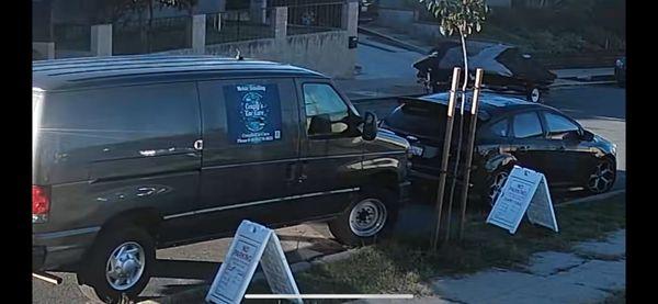 The work van for this company with the posted signs