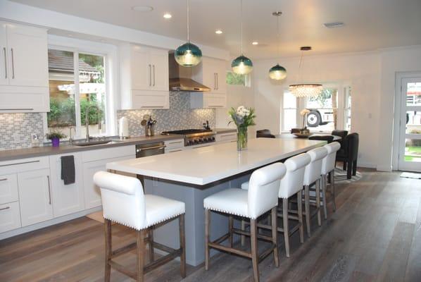 Bar stools re-upholstered with baseball stitching and tacks added. We love them!
