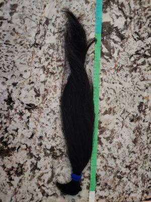 I asked her to cut 7-8in so I could donate. She took off almost 14in.