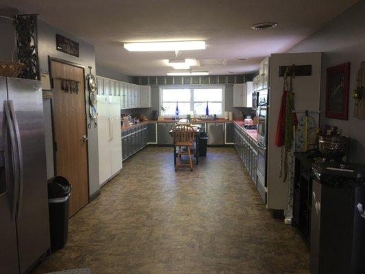 Huge Kitchen is stocked with crockpots, pots, pans dishes, everything you need to feed a small army.