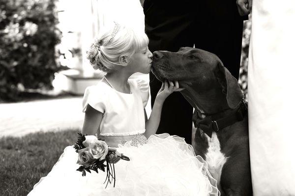 Our student doing her job as ring barer at her parents wedding... kissing the flower girl. Our students are just FaNtAsTiC !