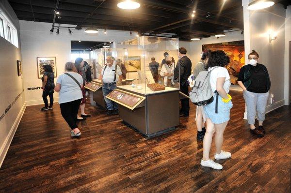 Visitors inside the main gallery of the Porter County Museum.