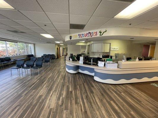 Empty understaffed unprofessional college student run office with nobody answering phone or working desk, USF Pediatrics