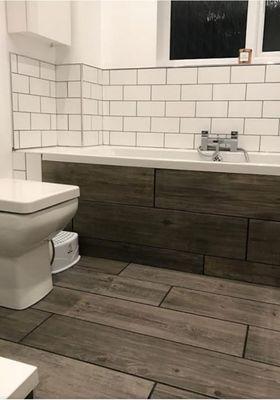 Bathroom tile work in floor 12"x 24" ceramic tile. And 4"x6" on walls