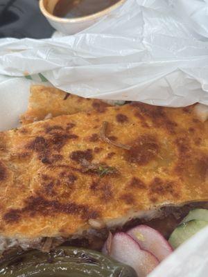 Just had quesabirria at this taco truck. It was really good with that sauce they give you to dip it in.