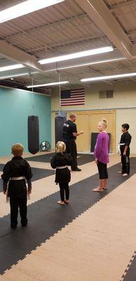 Mr. Nathan talking to the kids about making sure the only use what they learn for self-defense.