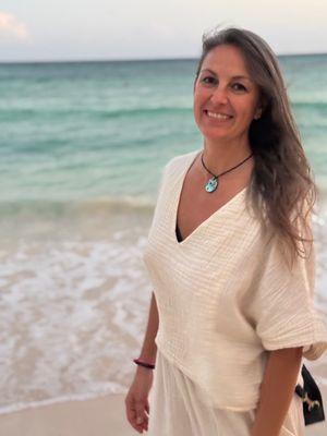Serene and tranquil white sandy beach with Heather smiling