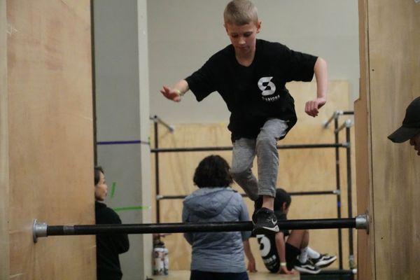 Photo from class where a student is attempting a speed course.