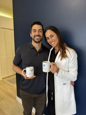 Office manager and Dr. Alvarado with some new mugs to celebrate the new office.