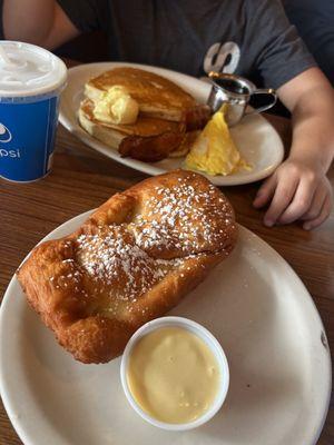 Kid's pancakes plus a scone.
