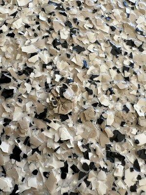 One of many clumps that are likely to peel off and damage the rest of the flooring.