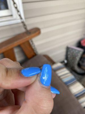 acrylic isn't covering the entire nail.