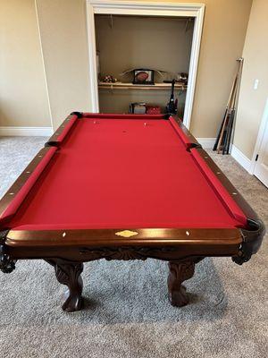 This is my three-piece slate pool table the Pool Table Pros moved upstairs and installed new felt on for me.