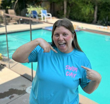 "Swim Day" on a rash guard swim shirt.