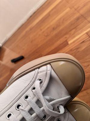 tan paint on white leather