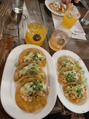 Left: Fish (salmon) taco Drink- mango guava margarita Right: Chicken tinga taco Drink- strawberry margarita