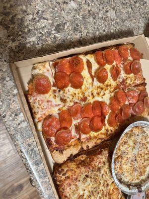 The corner slice with what appears to be tiny nibbles.