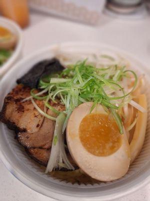 To-go container of Black Garlic Ramen