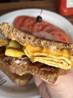 Bacon and egg sandwich (from sandwich menu section. no veggies version) - with side of tomatoes! Add American cheese! Delicious!