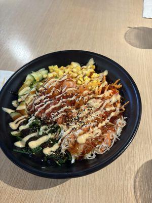 Poke bowl with salmon, spicy tuna and shredded crab