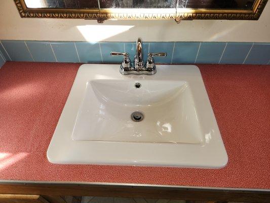 This new sink/faucet combo really brightened up this Eureka bathroom (and saved having to redo the countertop).