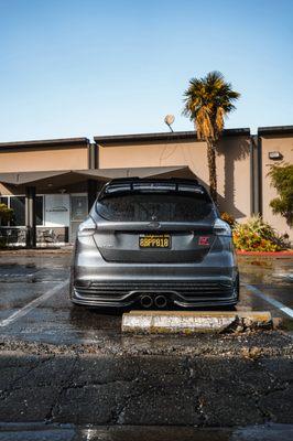 Tastefully modified Ford Focus outside our shop.