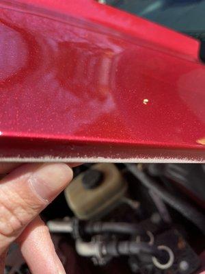 They nicked the hood with the sander and didn't put any paint on it.