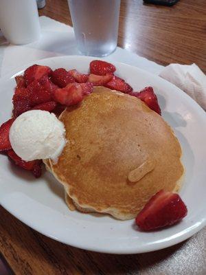 Silver dollar pancakes with strawberry topping.