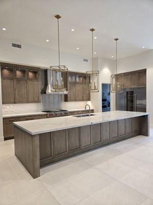 Large counter island with large format flooring.