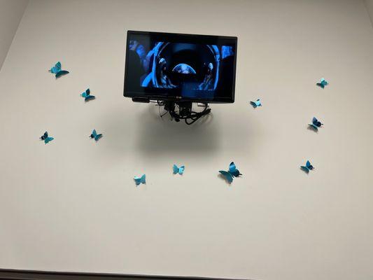 Looking up while getting my teeth clean, they give you the option to watch whatever you want