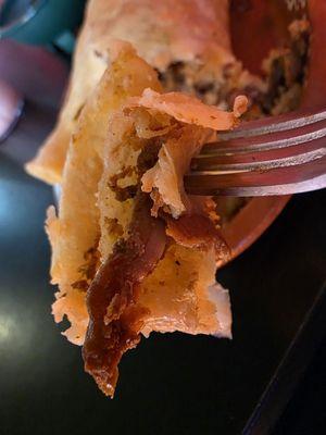 A fork holding a piece of my California Burrito al Pastor. A Culinary Masterpiece!