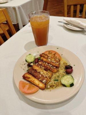 Fried cheese - Sliced halloumi cheese sautéed in olive oil and fresh garlic - also pictured is the Lebanese tea