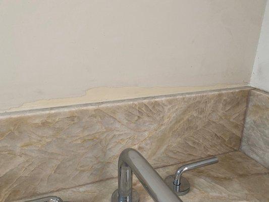 Walls damaged by the stone installers