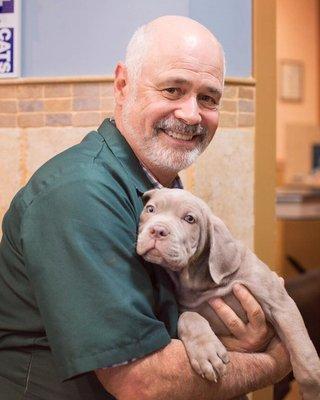 Dr. Lynch and our new patient, 9 week old bull mastiff puppy Bob!