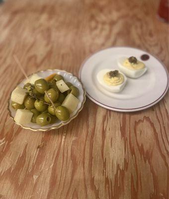 citrus and thyme marinated olives with manchego & devilish egg