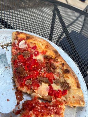 Goodfella Pizza: roasted red pepper, Italian sausage, fresh garlic, cheese covered in a dollop of red sauce.