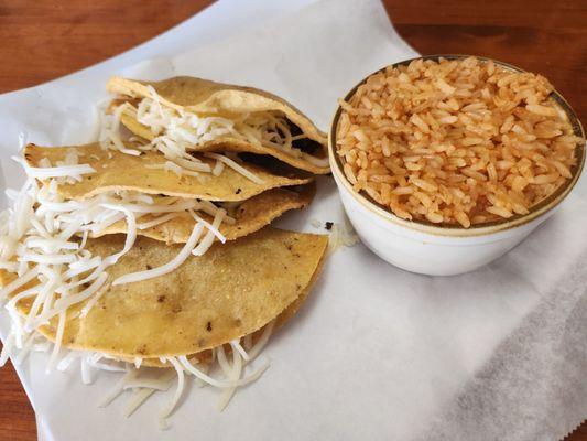Crispy tacos with a side of Spanish rice