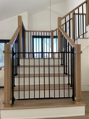 Custom made clamps to securely mount to this beautiful banister!