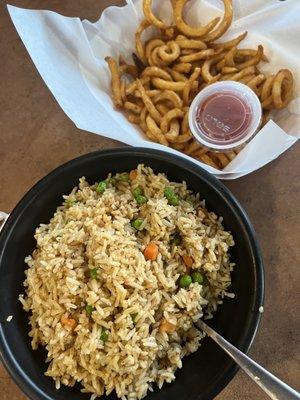 Crawfish fried rice and curly fries.