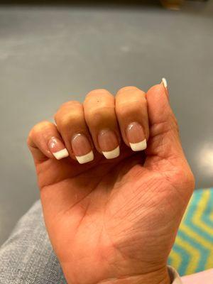 Different shapes on all the nails. Clunky and sloppy. Gel all over my skin around the nails.