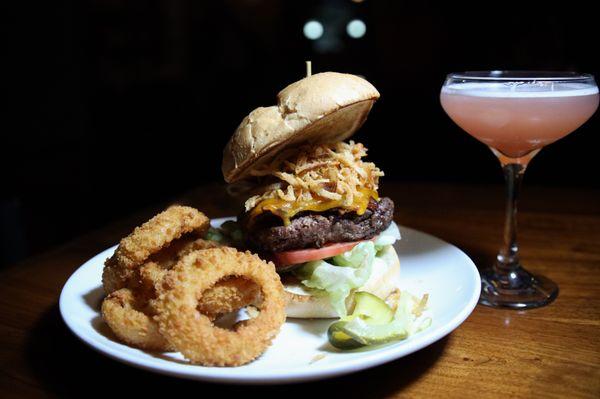 Hickory Burger - Smoked barbecue sauce, bacon, onion straws and cheddar cheese on a Kaiser roll - $15