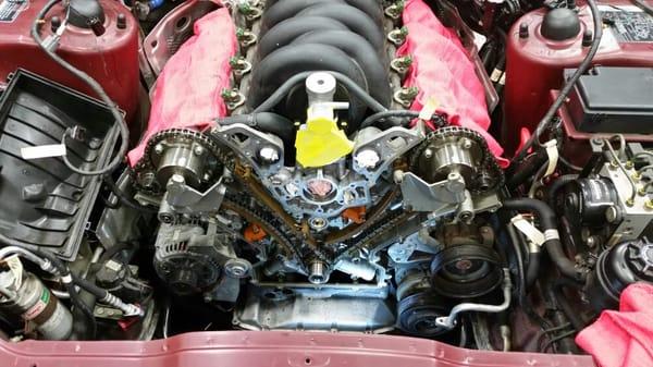 Mid-job timing chain replacement on a 1990s Jaguar XK8